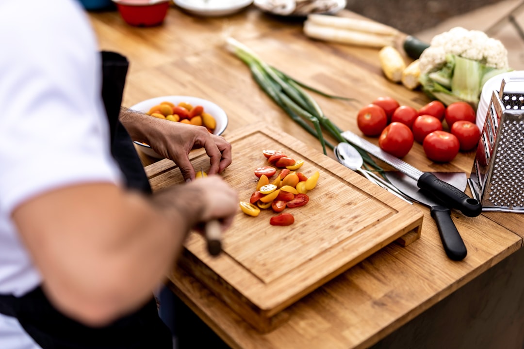 A busy kitchen with fresh ingredients and meal prep tools organized for efficient cooking.