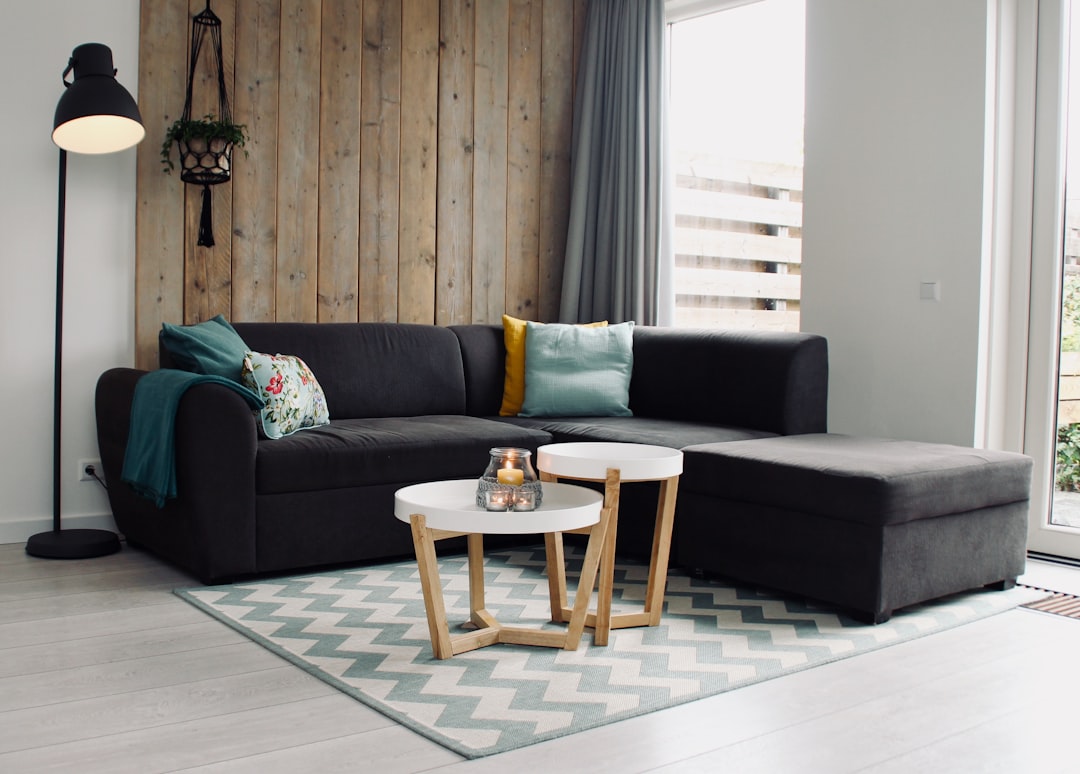 A well-decorated small living room with light colors and strategic furniture placement to create an illusion of space.
