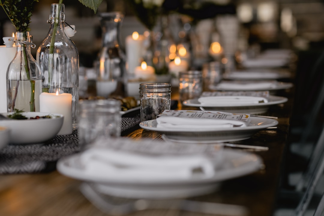 A beautifully styled dining table with simple yet elegant dinnerware, flatware, and a centerpiece, perfect for everyday meals.